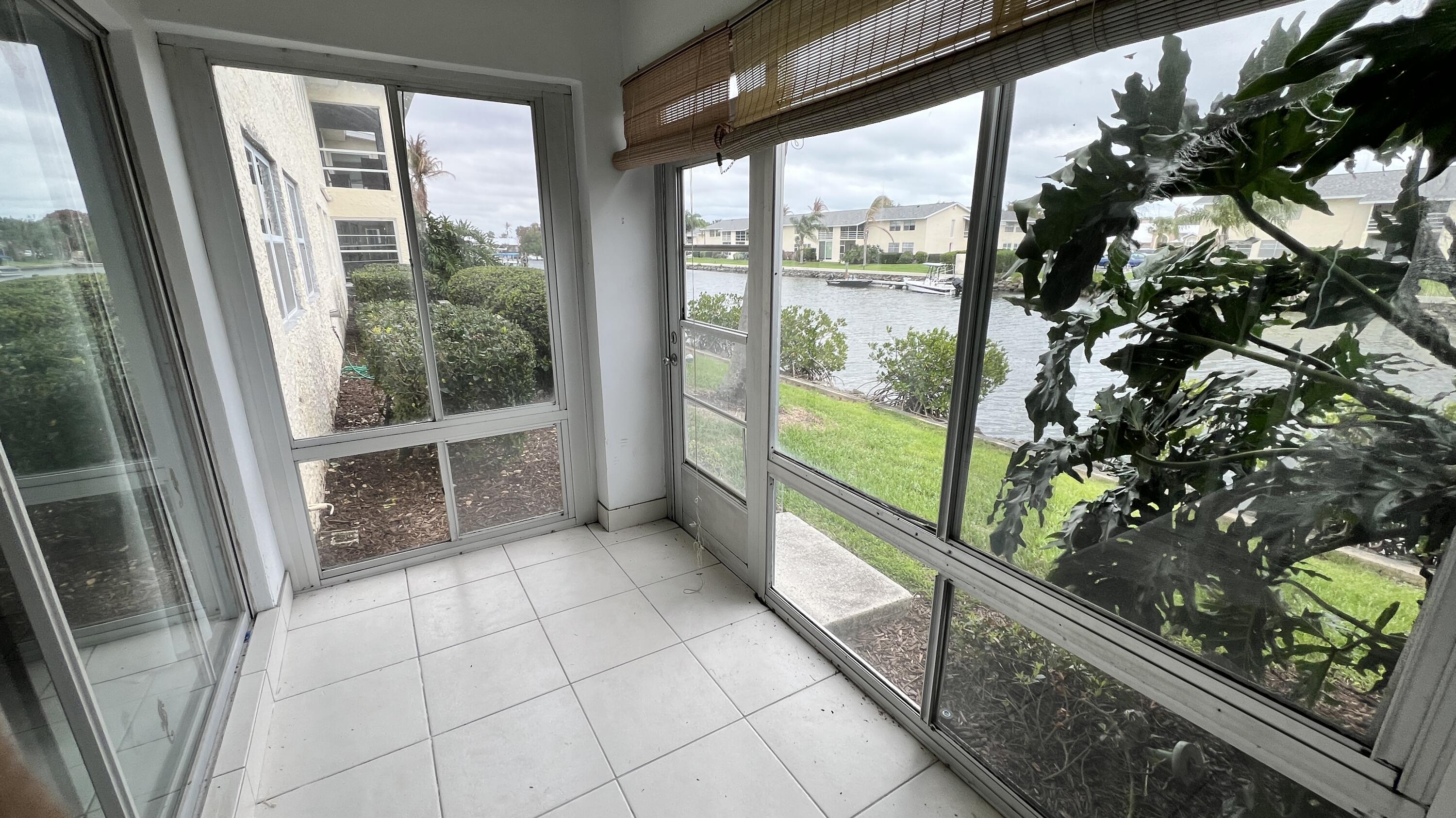 1860 Robalo Drive, Unit 104 Vero Beach, FL 32960 - Photo 10 of 11 a view of an entryway with garden view