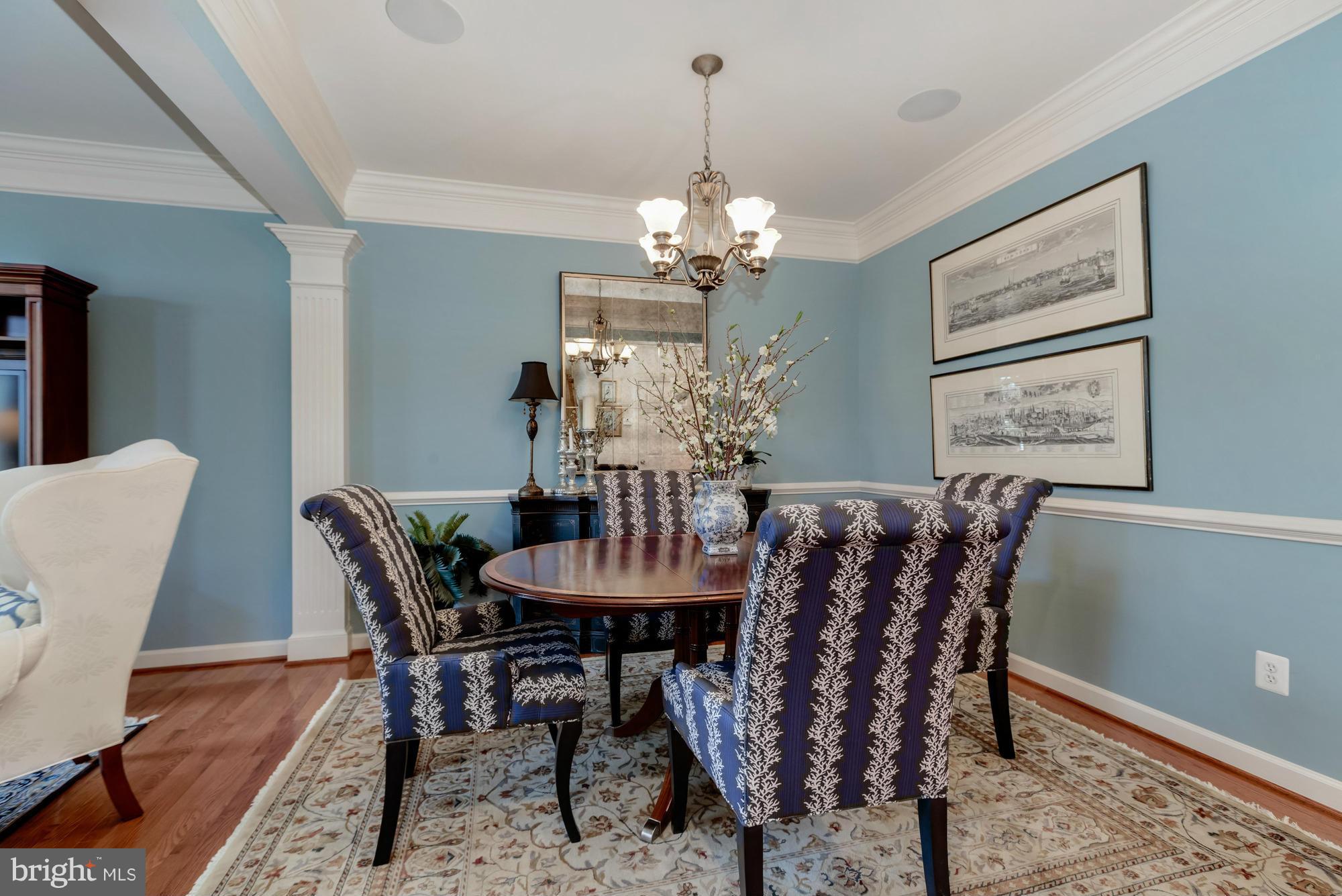 842 West Glebe Road Alexandria, VA 22305 - Photo 14 of 30 a view of a dining room with furniture a chandelier and wooden floor