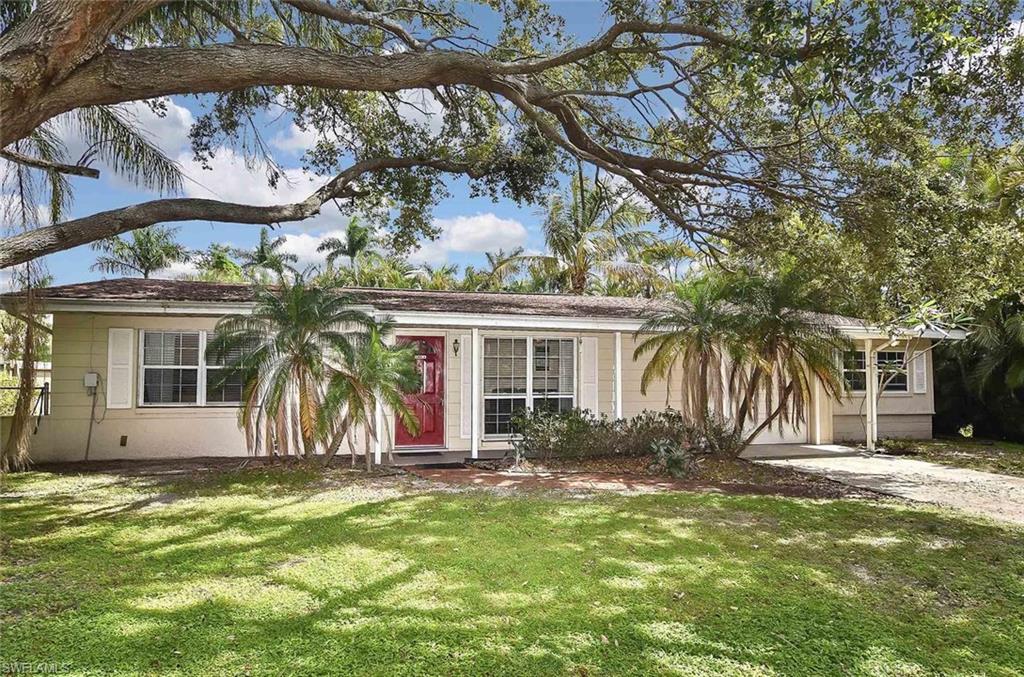 1431 Collins Road Fort Myers, FL 33919 - Photo 1 of 30 a view of a house with a yard