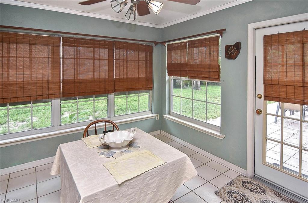 1431 Collins Road Fort Myers, FL 33919 - Photo 23 of 30 a view of a dining room with a large window