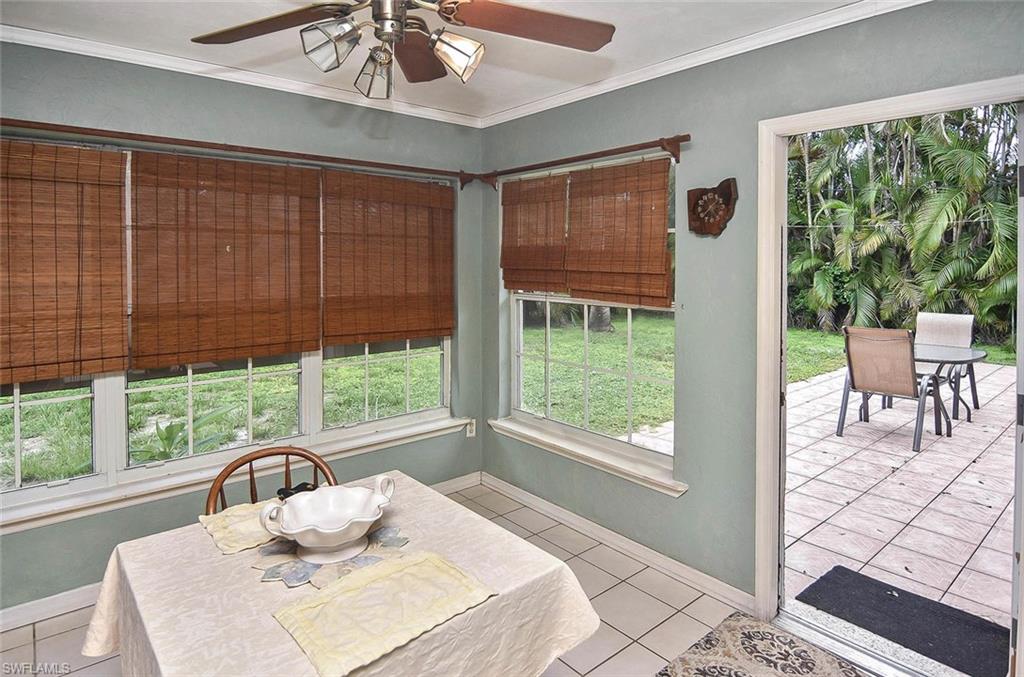 1431 Collins Road Fort Myers, FL 33919 - Photo 25 of 30 a view of a dining room with a large window