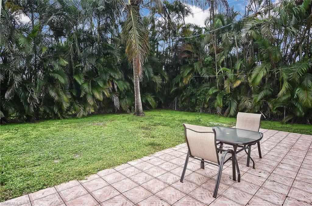 1431 Collins Road Fort Myers, FL 33919 - Photo 26 of 30 a view of a backyard with sitting area