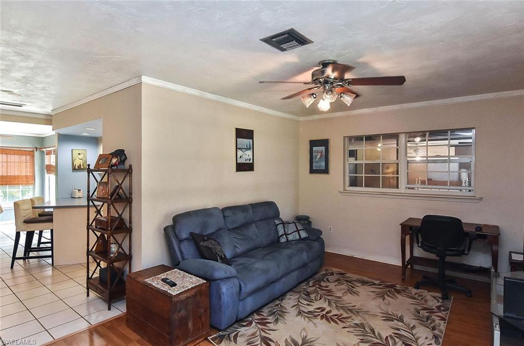 1431 Collins Road Fort Myers, FL 33919 - Photo 4 of 30 a living room with furniture and a window