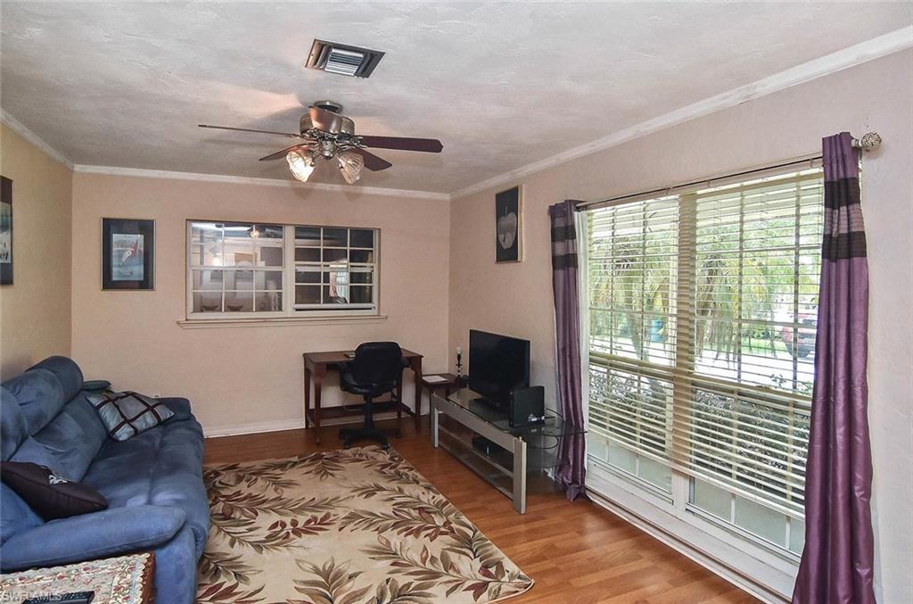 1431 Collins Road Fort Myers, FL 33919 - Photo 5 of 30 a living room with furniture and a window