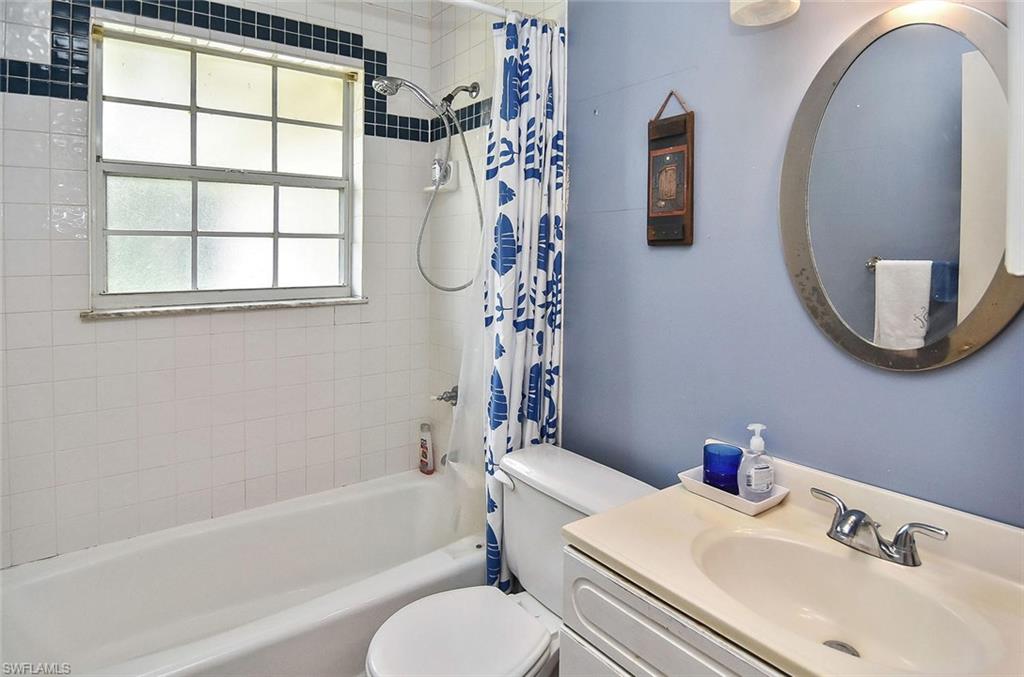 1431 Collins Road Fort Myers, FL 33919 - Photo 8 of 30 a bathroom with a sink a toilet and a bathtub