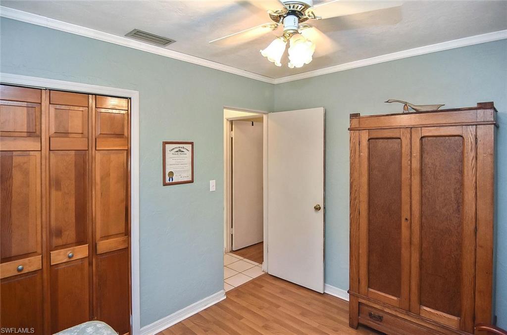 1431 Collins Road Fort Myers, FL 33919 - Photo 10 of 30 a view of a hallway with wooden floor