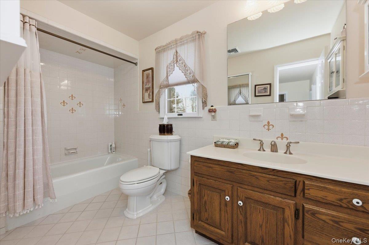 15 Lake Gilead Road Carmel, NY 10512 - Photo 20 of 27 a spacious bathroom with a sink a toilet and a mirror