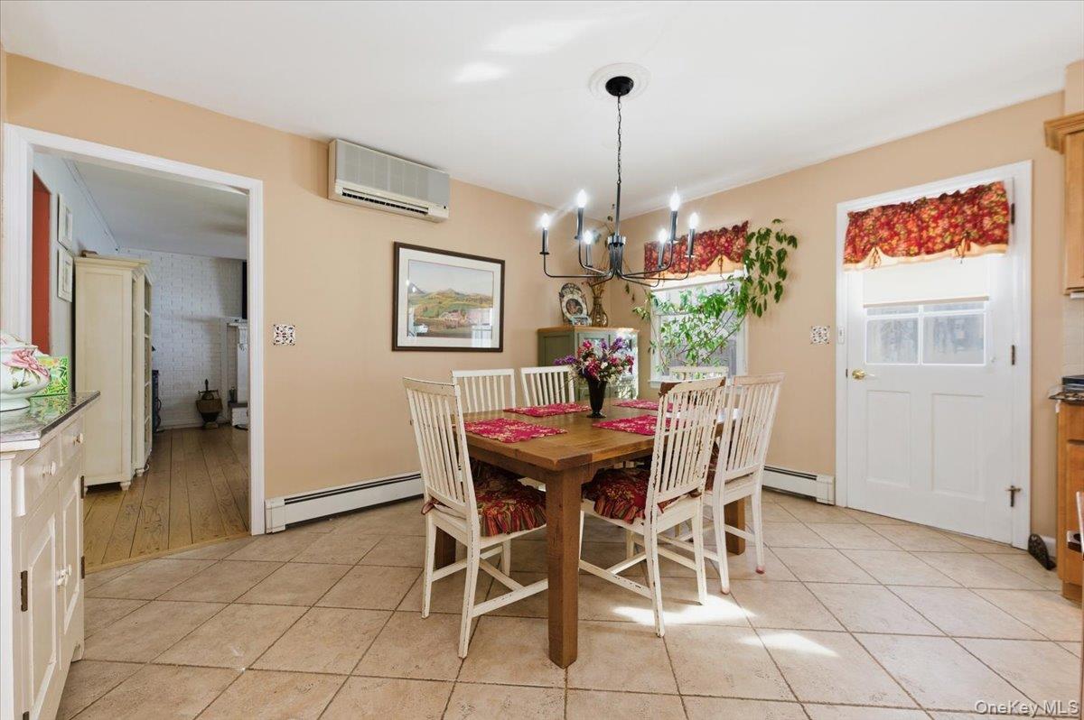 15 Lake Gilead Road Carmel, NY 10512 - Photo 10 of 27 a view of a dining room with furniture and chandelier