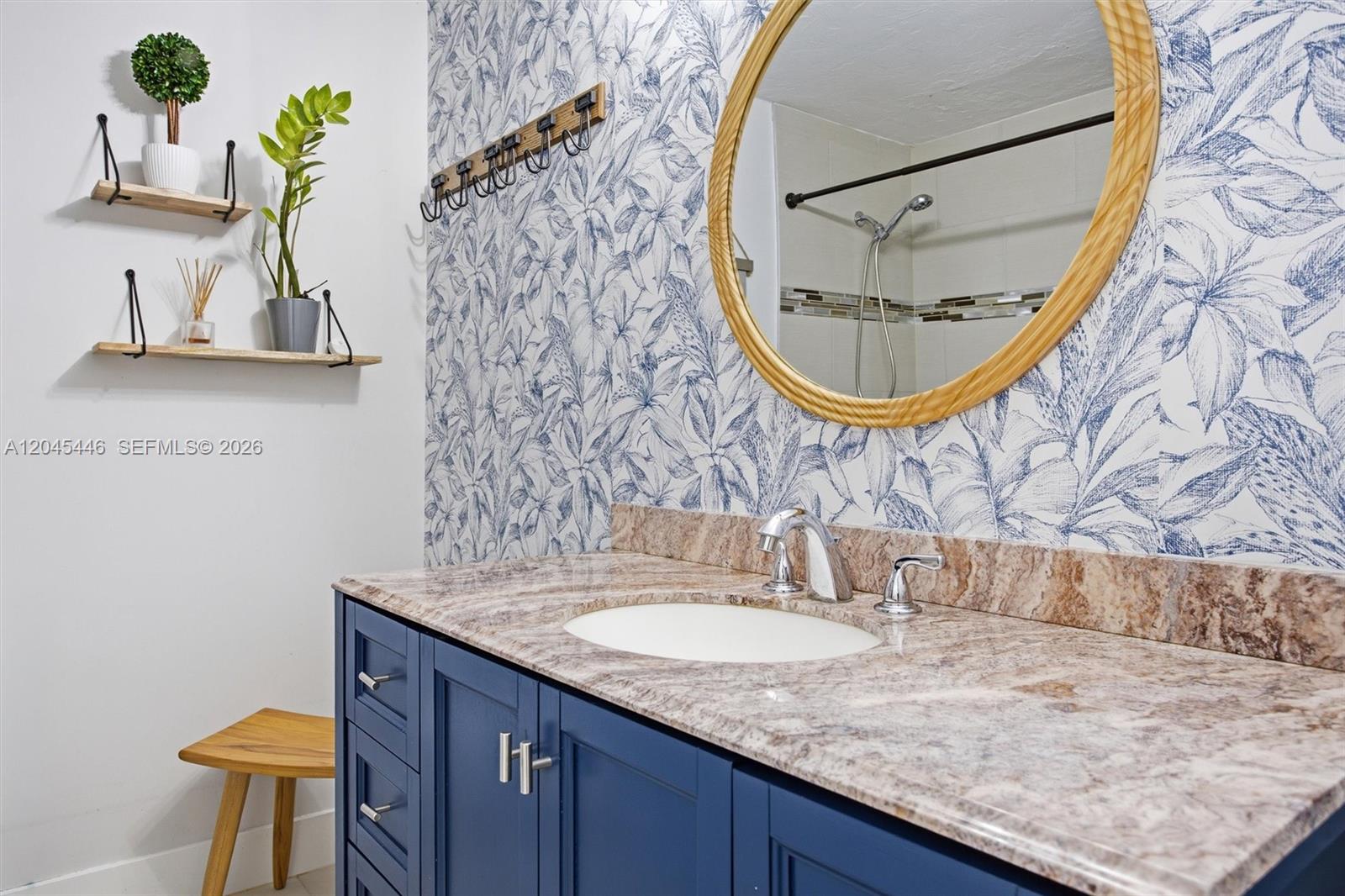 8440 Southwest 180th Street Palmetto Bay, FL 33157 - Photo 18 of 54 a bathroom with a sink and a mirror