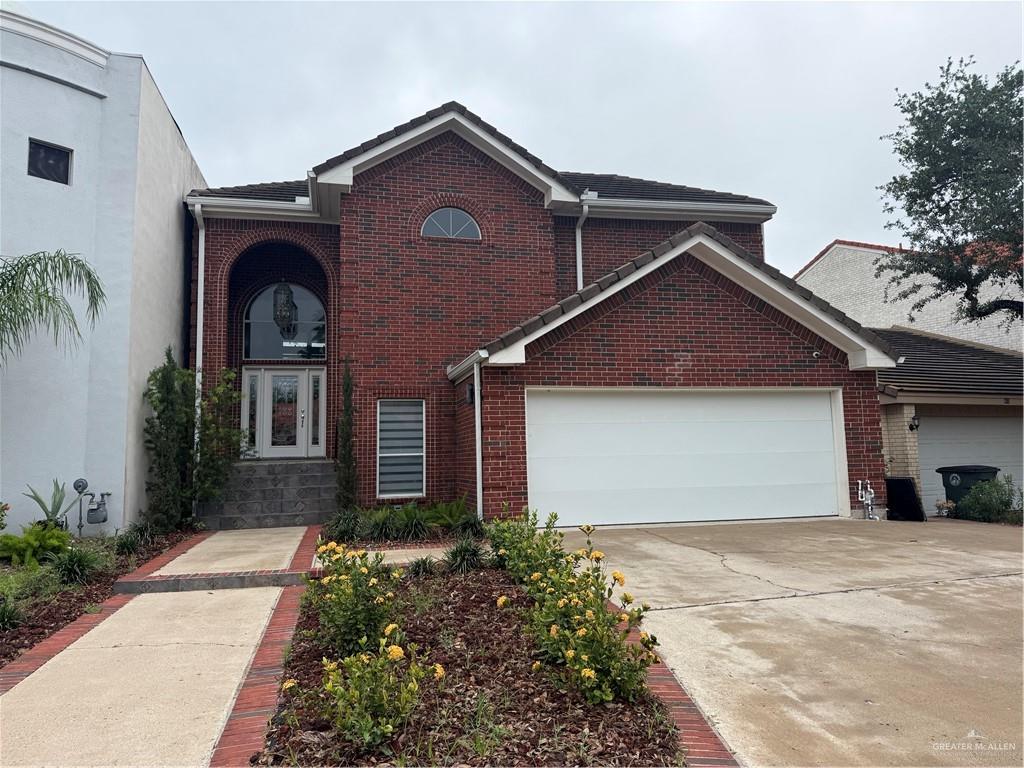 420 Rio Grande Drive Mission, TX 78572 - Photo 1 of 1 a front view of a house with a yard and garage