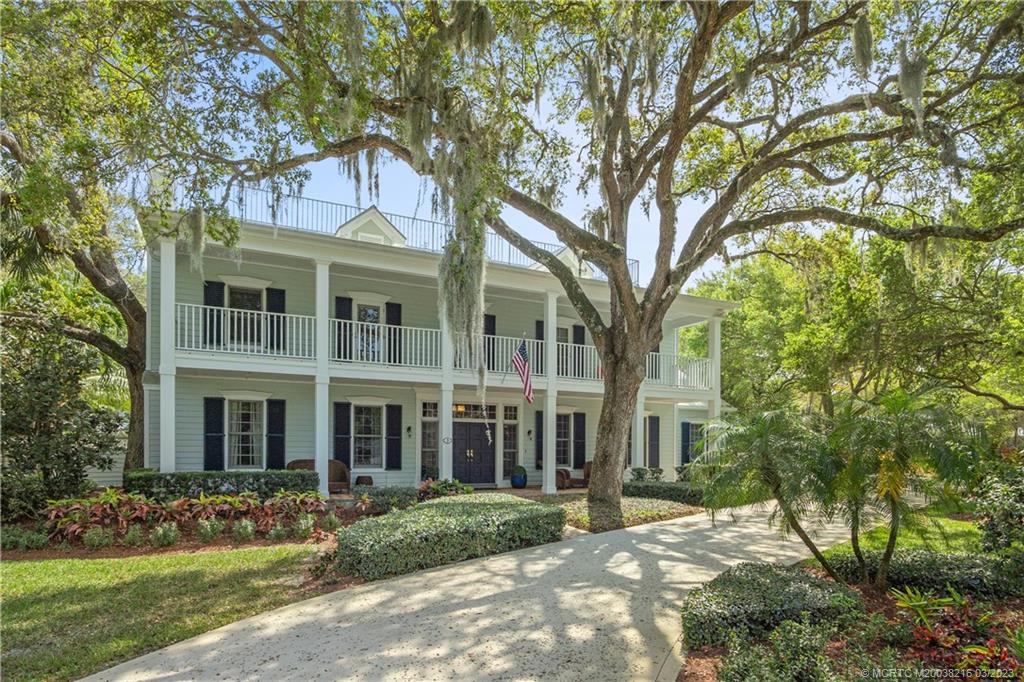 front view of a building with a garden