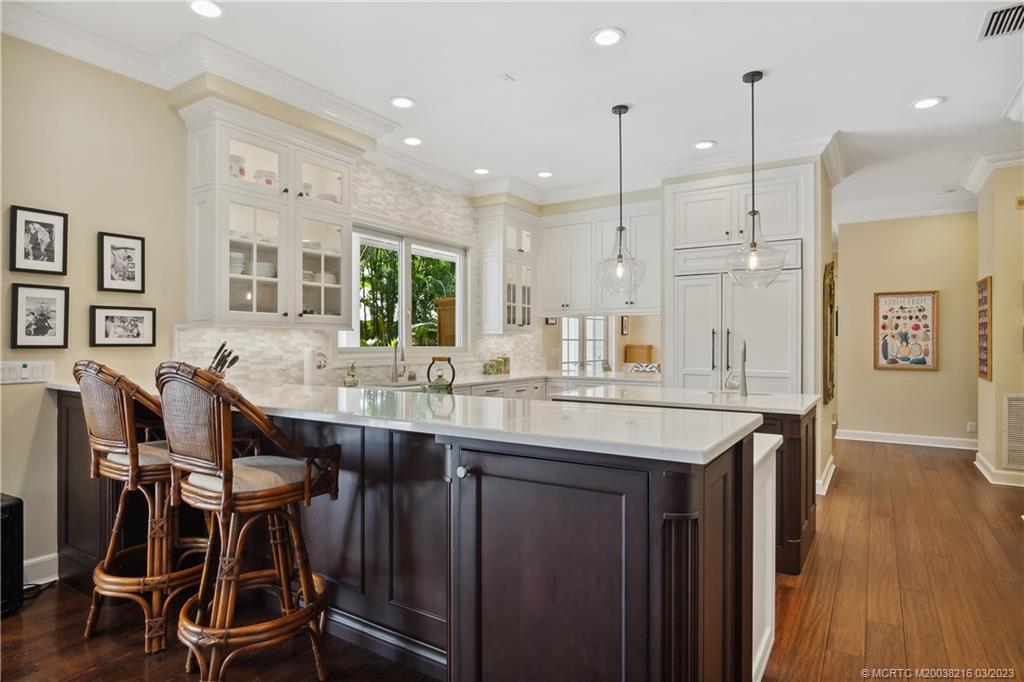 9 Pineapple Lane Stuart, FL 34996 - Photo 11 of 33 a large kitchen with a table and chairs