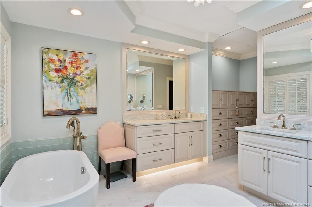 9 Pineapple Lane Stuart, FL 34996 - Photo 19 of 33 a spacious bathroom with a sink double vanity and a bathtub