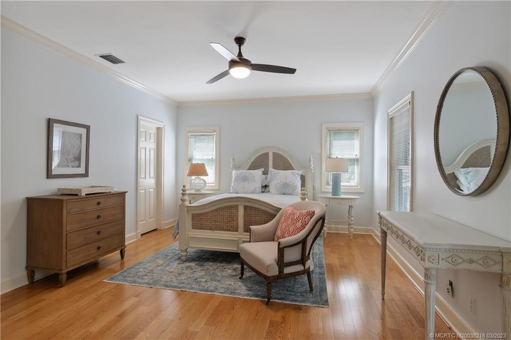 9 Pineapple Lane Stuart, FL 34996 - Photo 20 of 33 a living room with furniture and a mirror