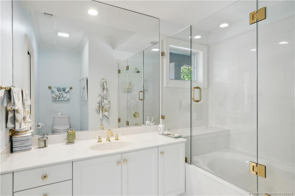 9 Pineapple Lane Stuart, FL 34996 - Photo 21 of 33 a bathroom with a shower tub double and sink