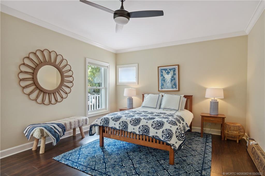 9 Pineapple Lane Stuart, FL 34996 - Photo 22 of 33 a bedroom with a bed and dresser