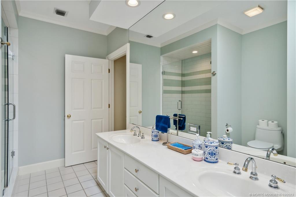 9 Pineapple Lane Stuart, FL 34996 - Photo 23 of 33 a bathroom with a double vanity sink mirror and double