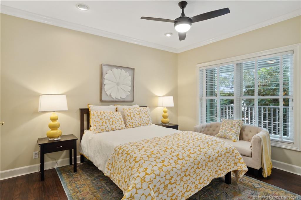 9 Pineapple Lane Stuart, FL 34996 - Photo 24 of 33 a bedroom with a large bed and a large window