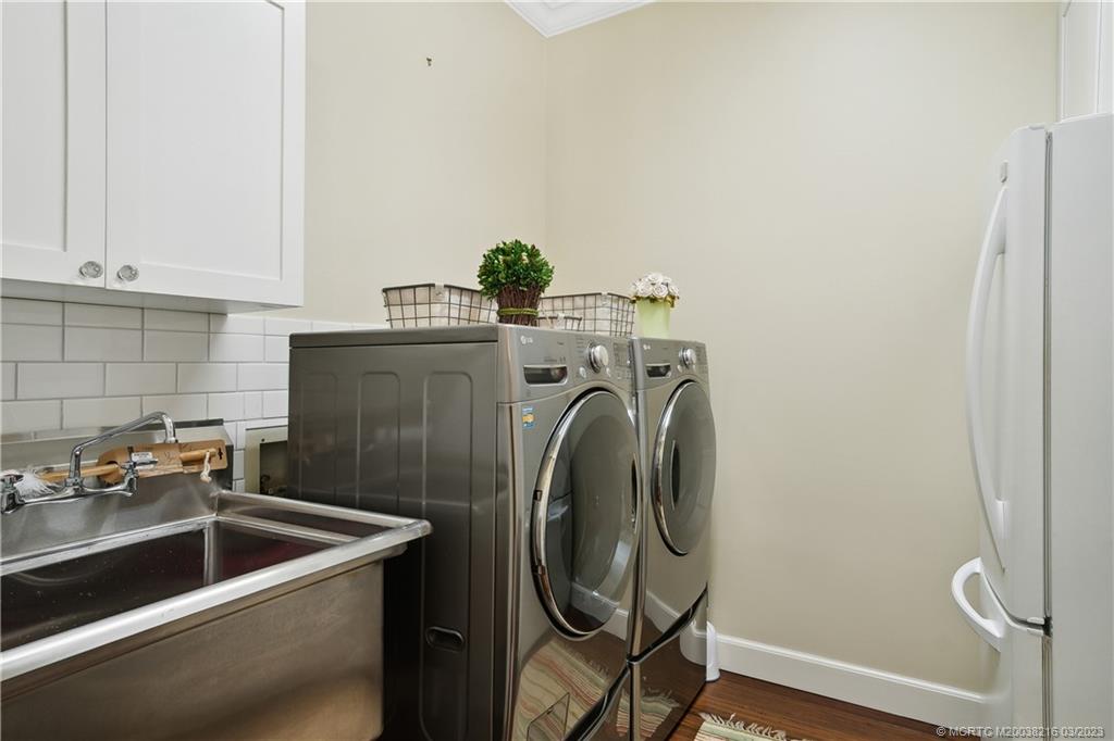 9 Pineapple Lane Stuart, FL 34996 - Photo 25 of 33 a utility room with dryer and washer