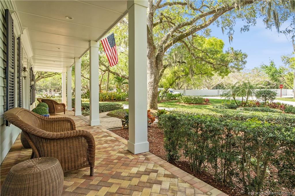 9 Pineapple Lane Stuart, FL 34996 - Photo 4 of 33 a living room with furniture and a yard