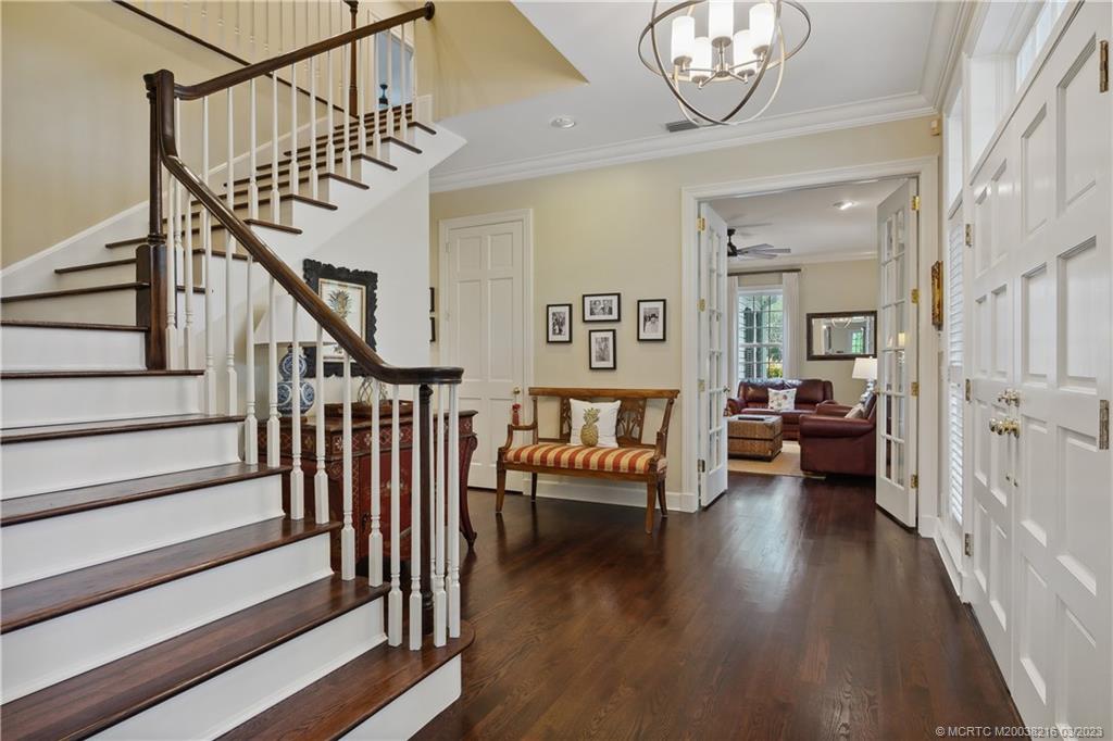 9 Pineapple Lane Stuart, FL 34996 - Photo 7 of 33 a view of entryway livingroom and hall with wooden floor