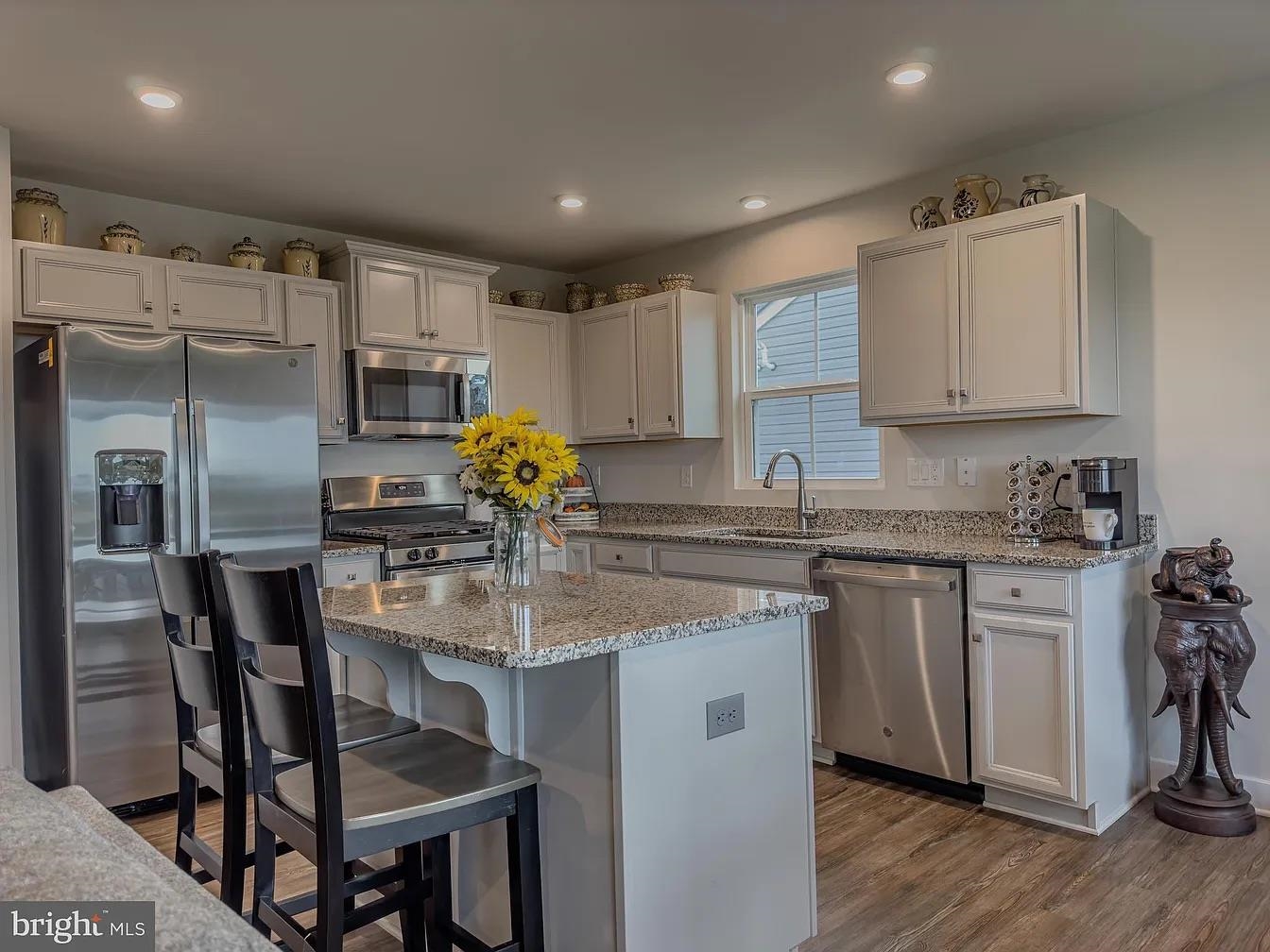 18 Bustleton Millville, NJ 08332 - Photo 2 of 19 a kitchen with kitchen island granite countertop a sink cabinets and stainless steel appliances