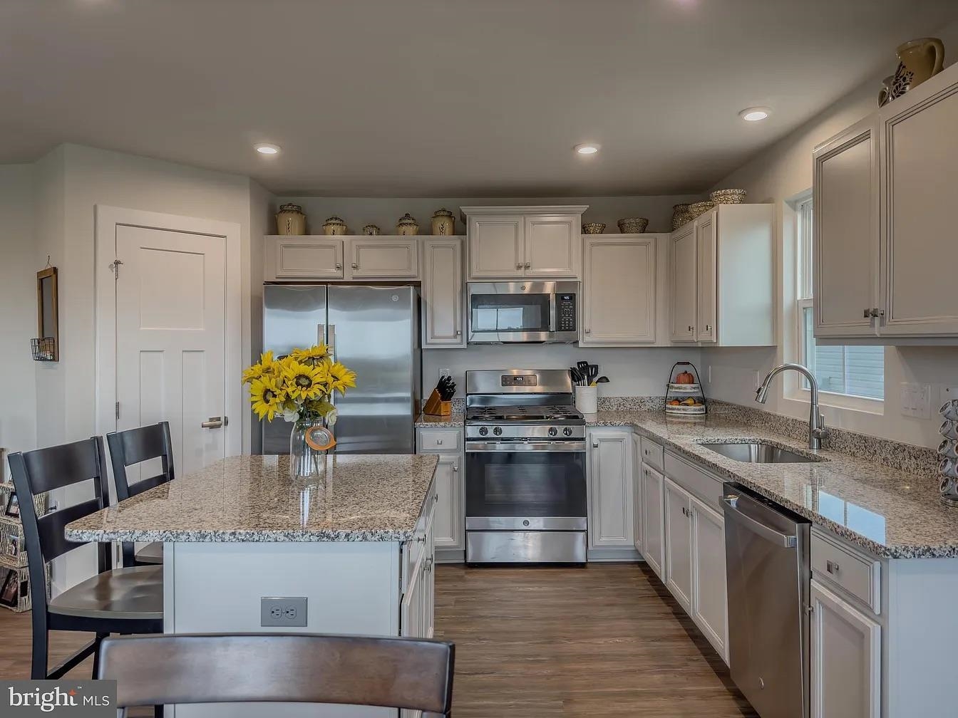 18 Bustleton Millville, NJ 08332 - Photo 3 of 19 a kitchen with kitchen island granite countertop a sink cabinets and stainless steel appliances