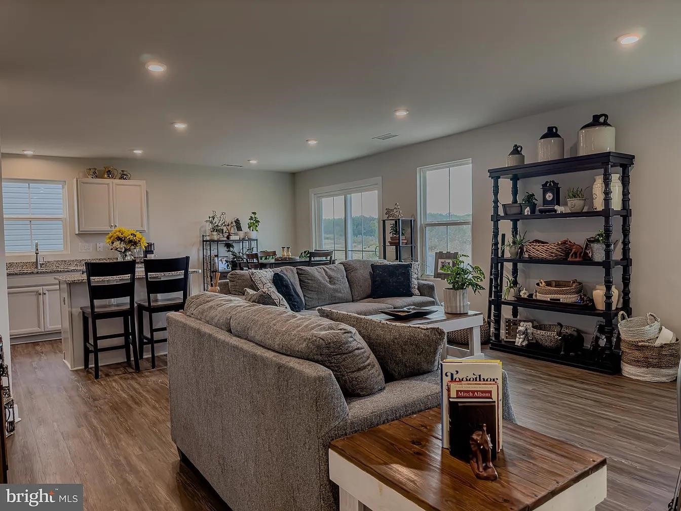 18 Bustleton Millville, NJ 08332 - Photo 4 of 19 a living room with furniture kitchen view and a wooden floor