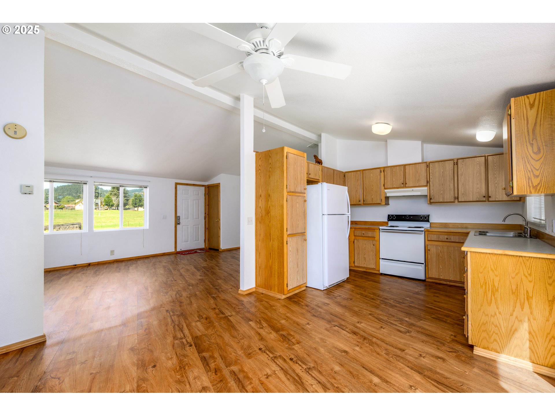 425 Moon Hill Road Tenmile, OR 97481 - Photo 23 of 42 a kitchen with refrigerator and microwave