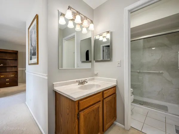 a bathroom with a sink a vanity and a mirror
