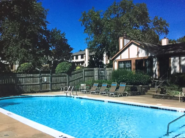 a view of a swimming pool with a patio