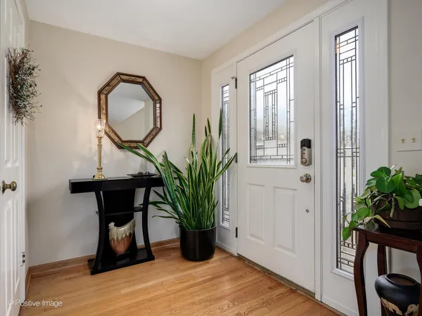 a view of a livingroom with furniture and a potted plant