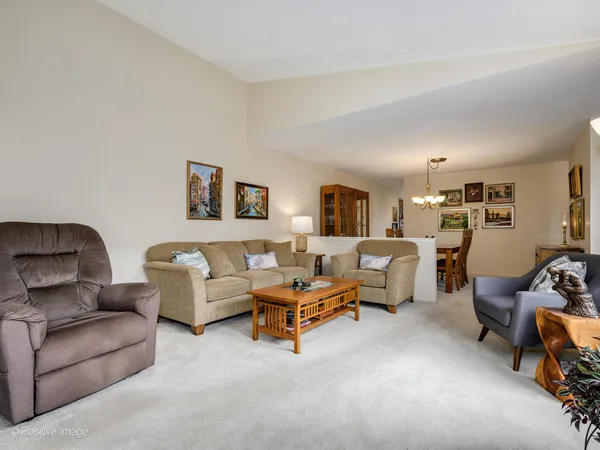 a living room with furniture and a table