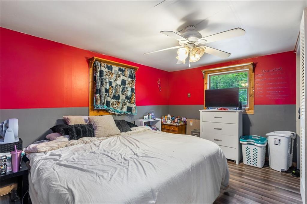 368 Echo Ridge Road Apollo, PA 15613 - Photo 11 of 24 a bedroom with a bed a flat screen tv and a window