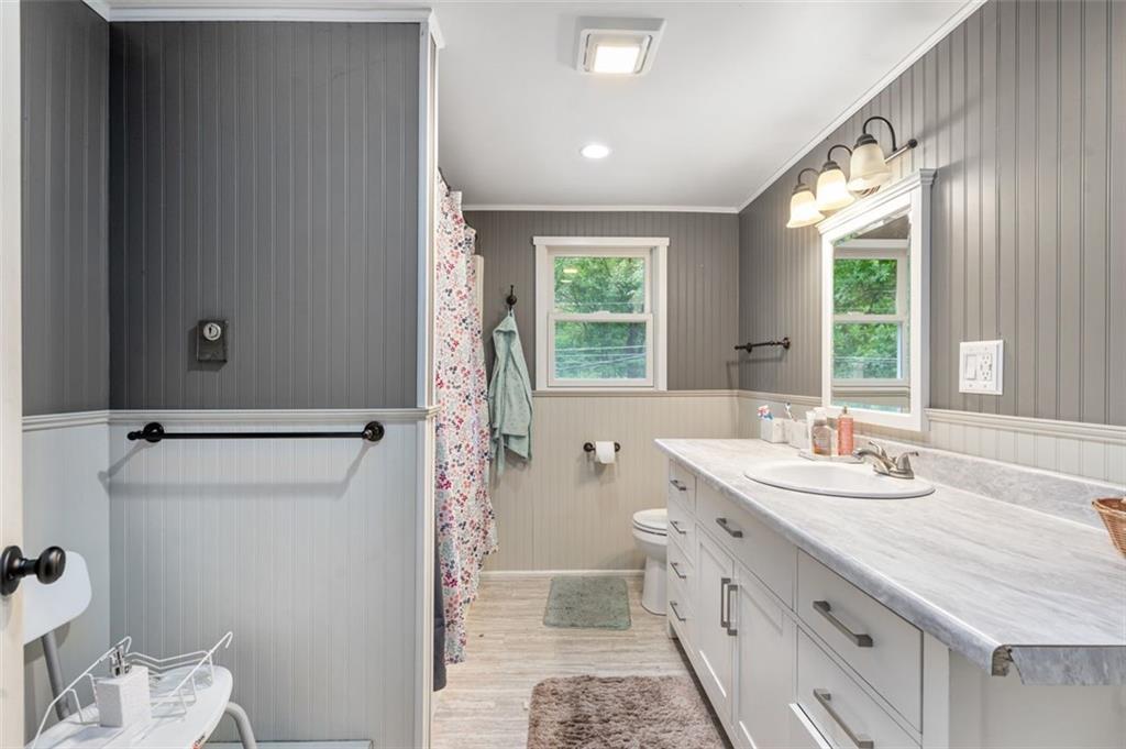 368 Echo Ridge Road Apollo, PA 15613 - Photo 14 of 24 a bathroom with a double vanity sink toilet and next to a window