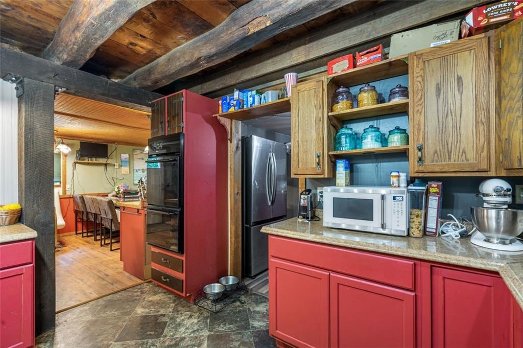 368 Echo Ridge Road Apollo, PA 15613 - Photo 20 of 24 a kitchen with stainless steel appliances granite countertop a refrigerator and a sink