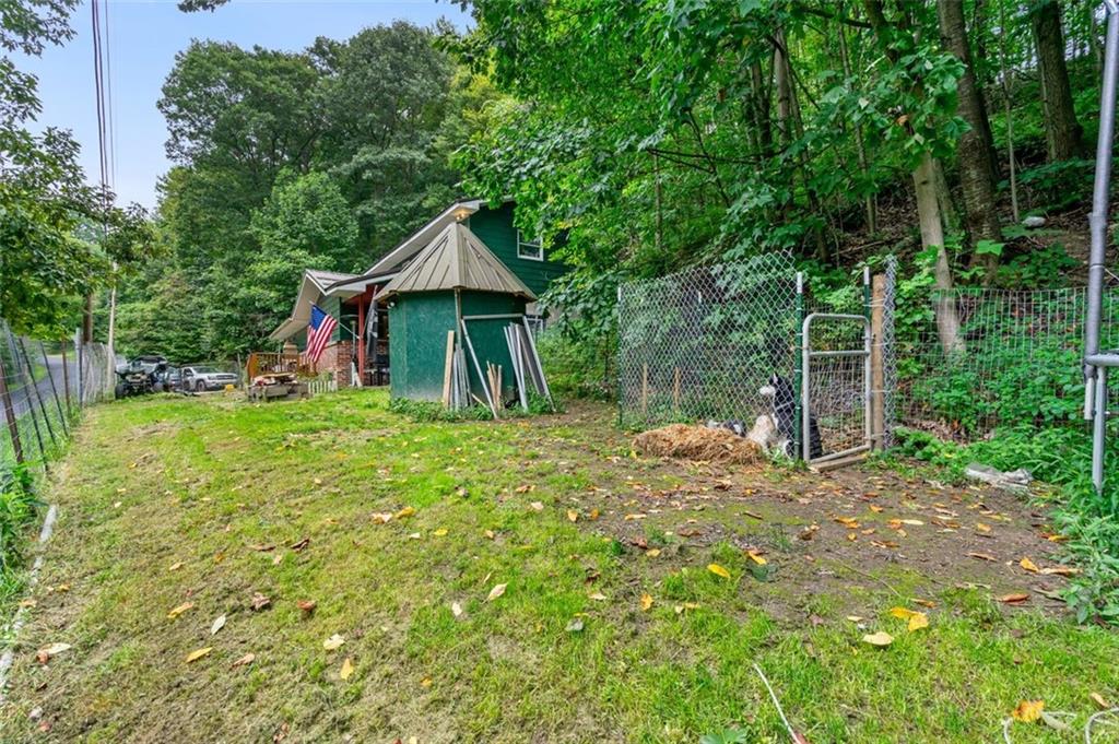 368 Echo Ridge Road Apollo, PA 15613 - Photo 23 of 24 a view of a chair and table in backyard of the house