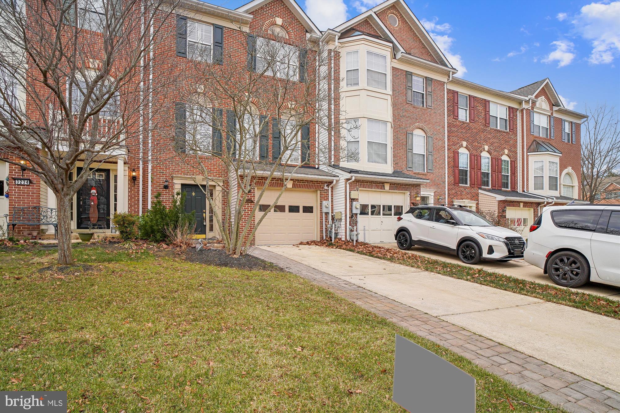 a car parked in front of a brick building