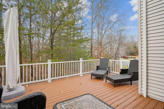 a view of a chair and table on the deck
