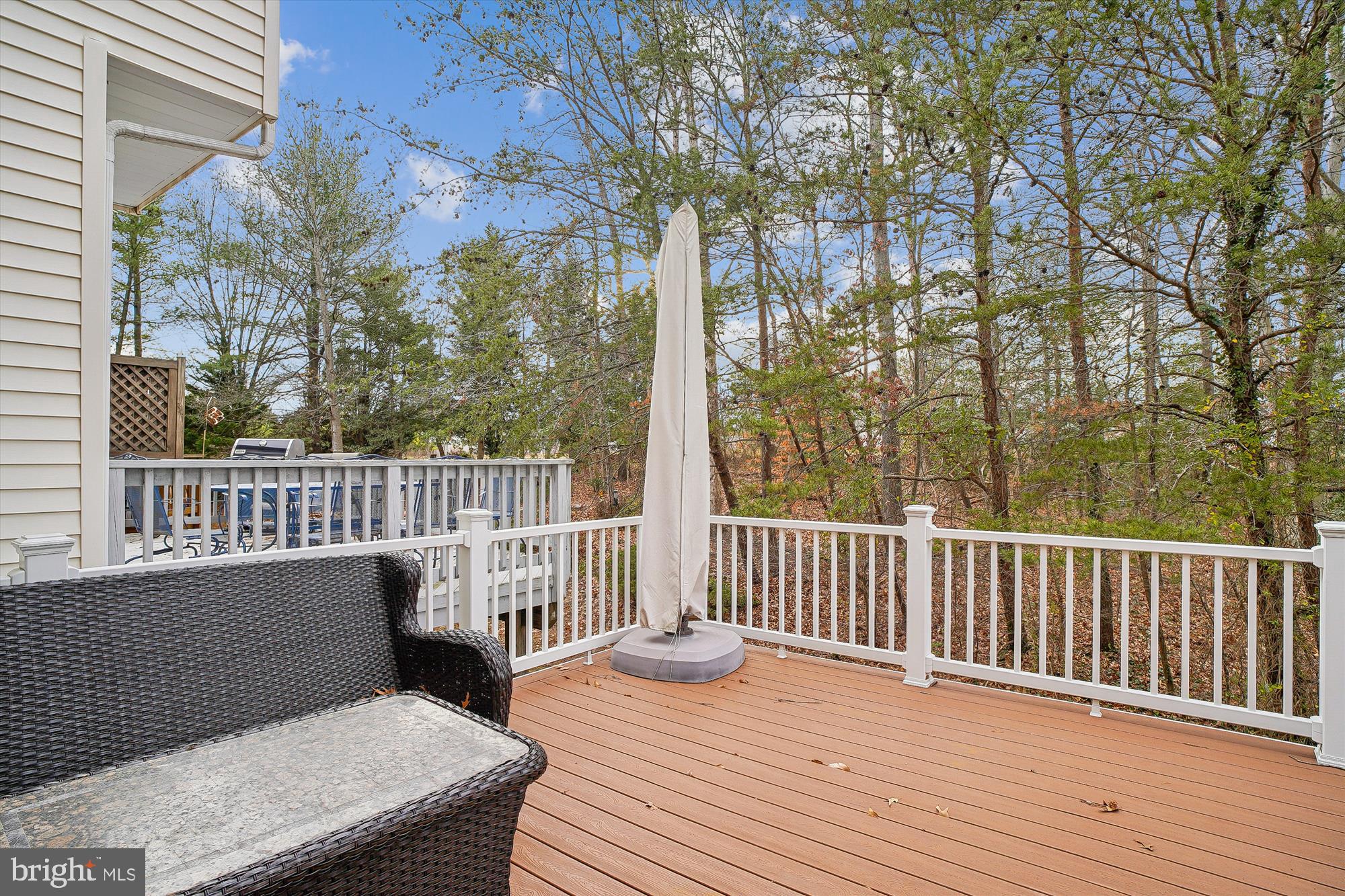 3232 Escapade Circle Riva, MD 21140 - Photo 13 of 38 a view of a wooden deck and a yard