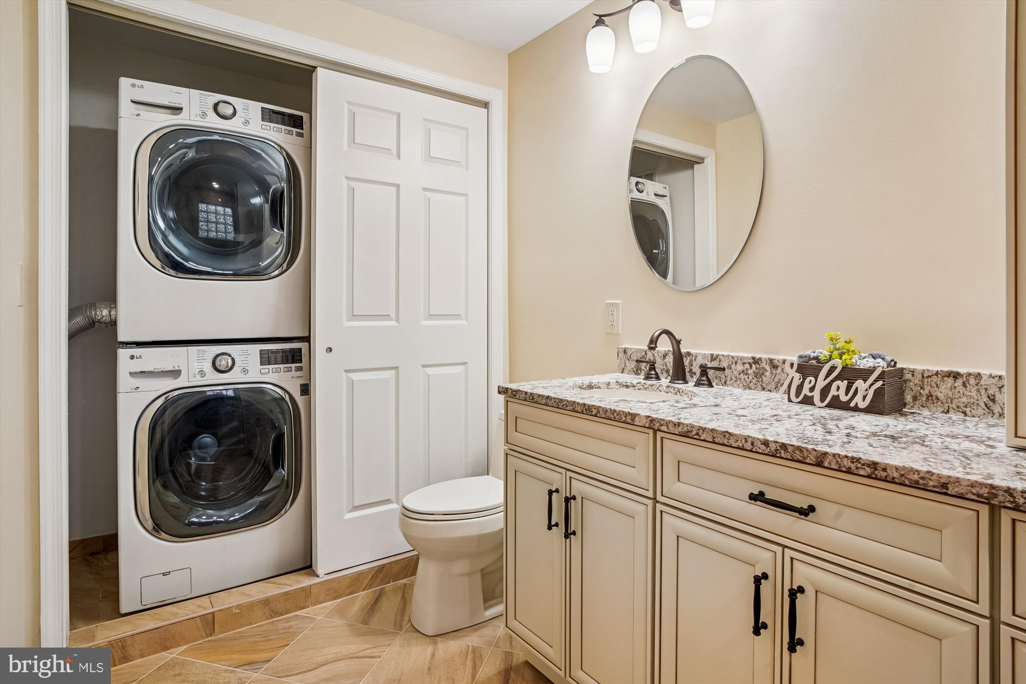 3232 Escapade Circle Riva, MD 21140 - Photo 18 of 38 a en suite bathroom with a toilet sink and mirror