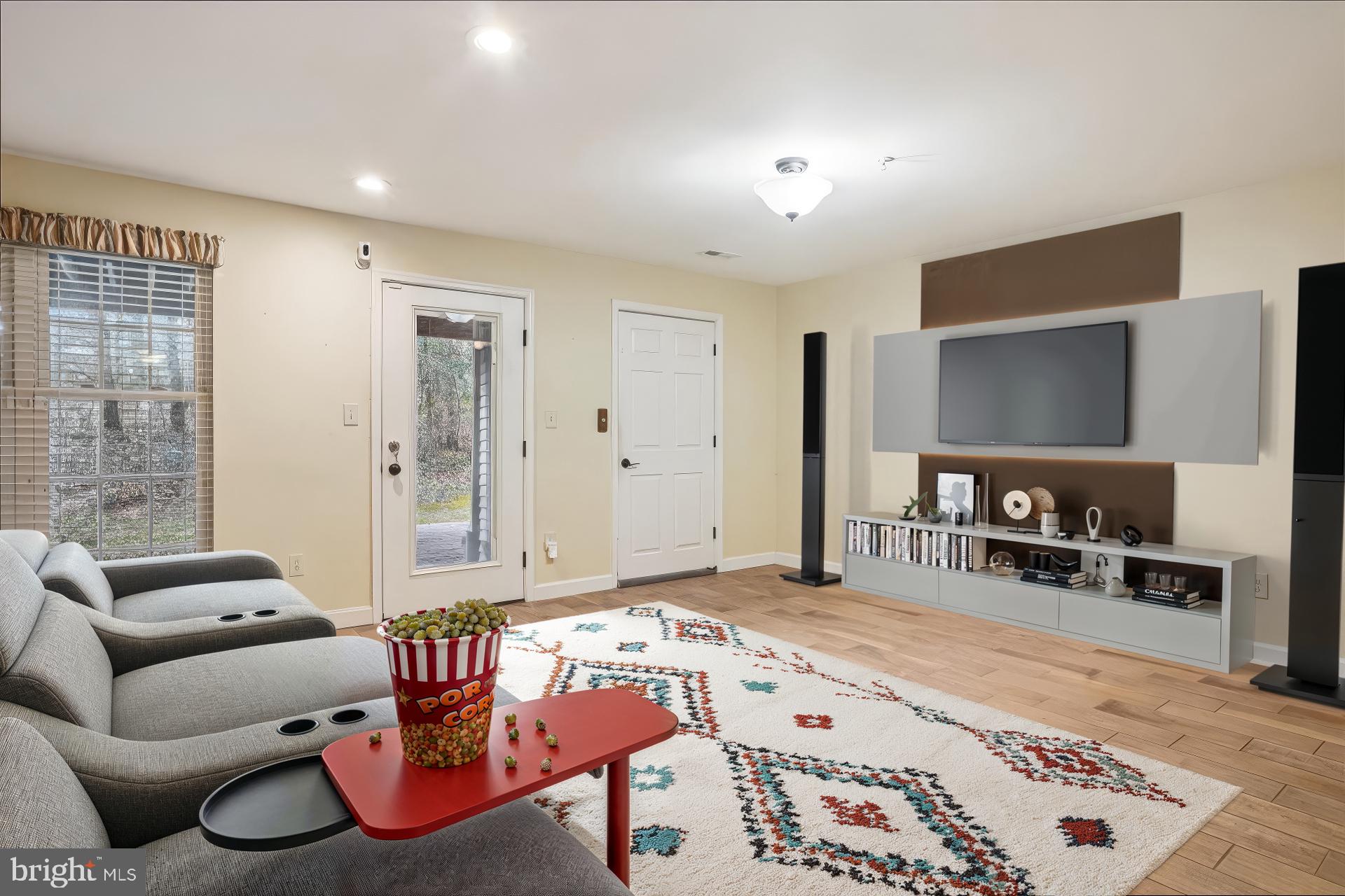 3232 Escapade Circle Riva, MD 21140 - Photo 24 of 38 a living room with furniture and a flat screen tv