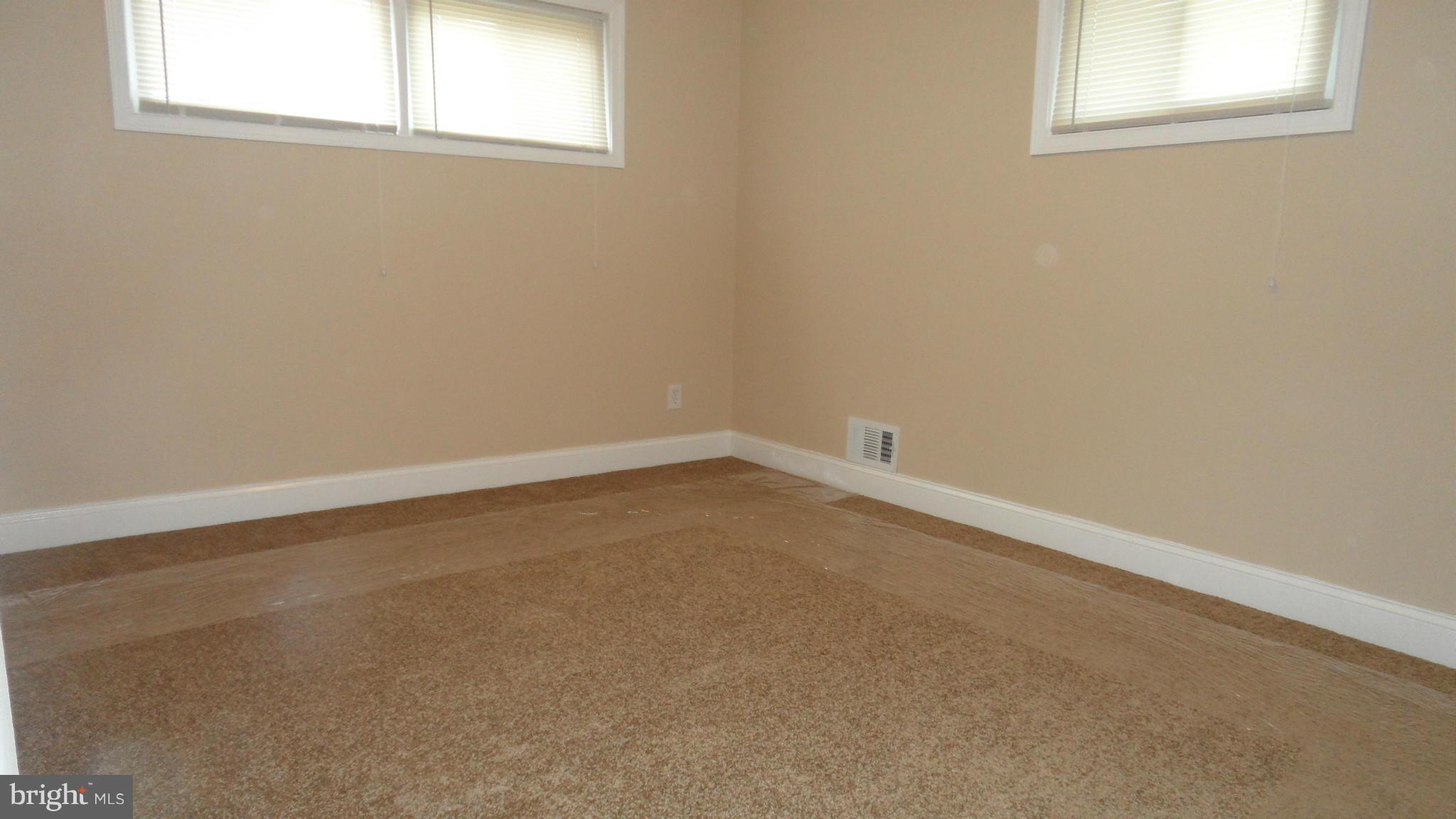 7413 Sudbrook Road Baltimore, MD 21208 - Photo 11 of 30 an empty room with a window