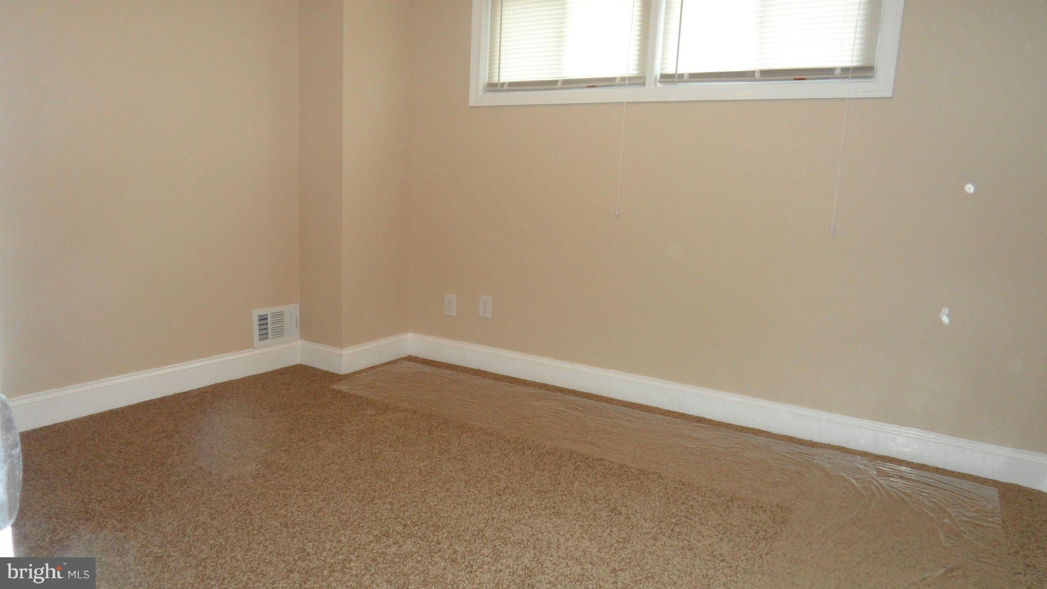 7413 Sudbrook Road Baltimore, MD 21208 - Photo 12 of 30 an empty room with a window
