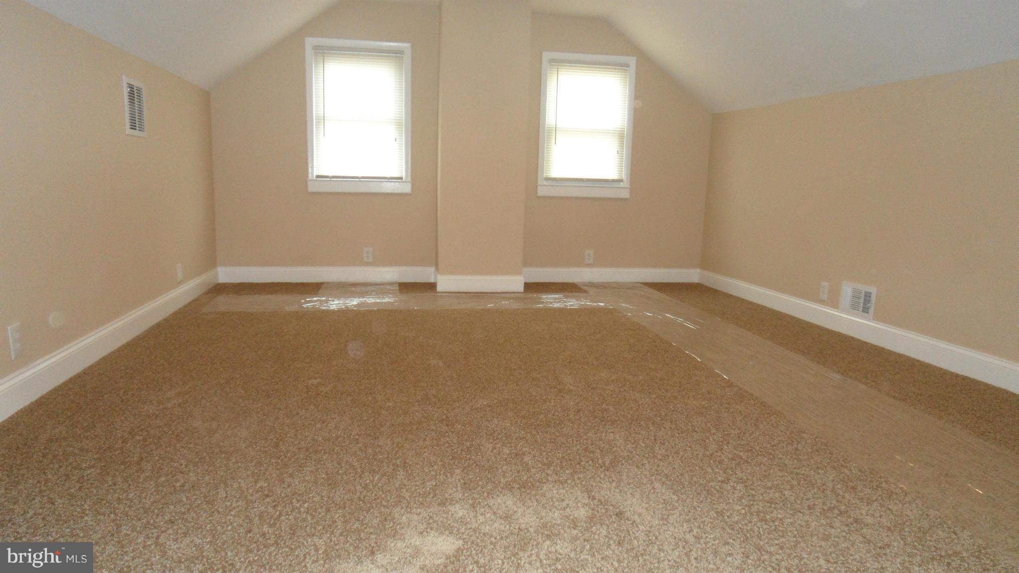 7413 Sudbrook Road Baltimore, MD 21208 - Photo 15 of 30 an empty room with a window