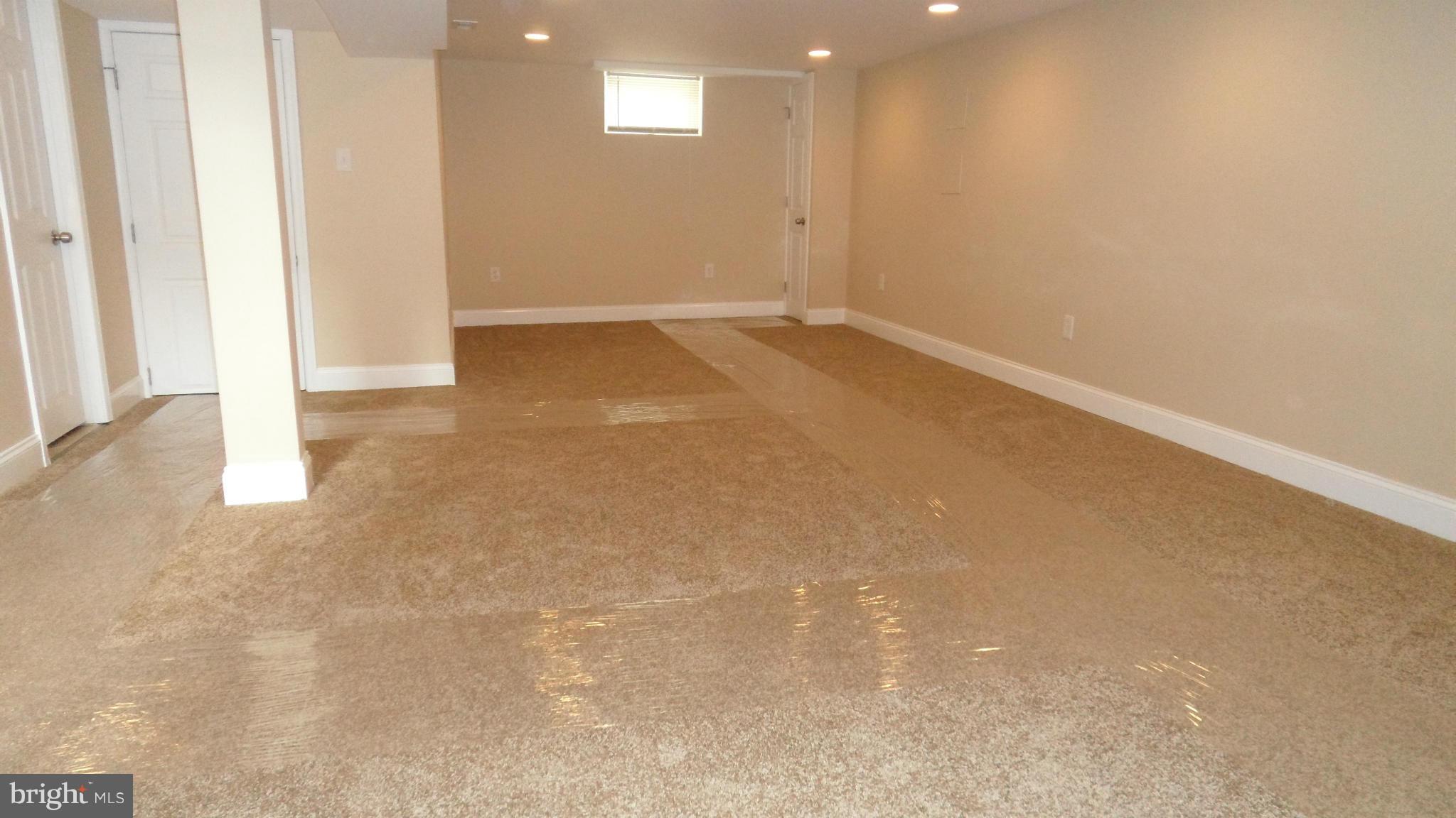 7413 Sudbrook Road Baltimore, MD 21208 - Photo 21 of 30 en empty room with windows