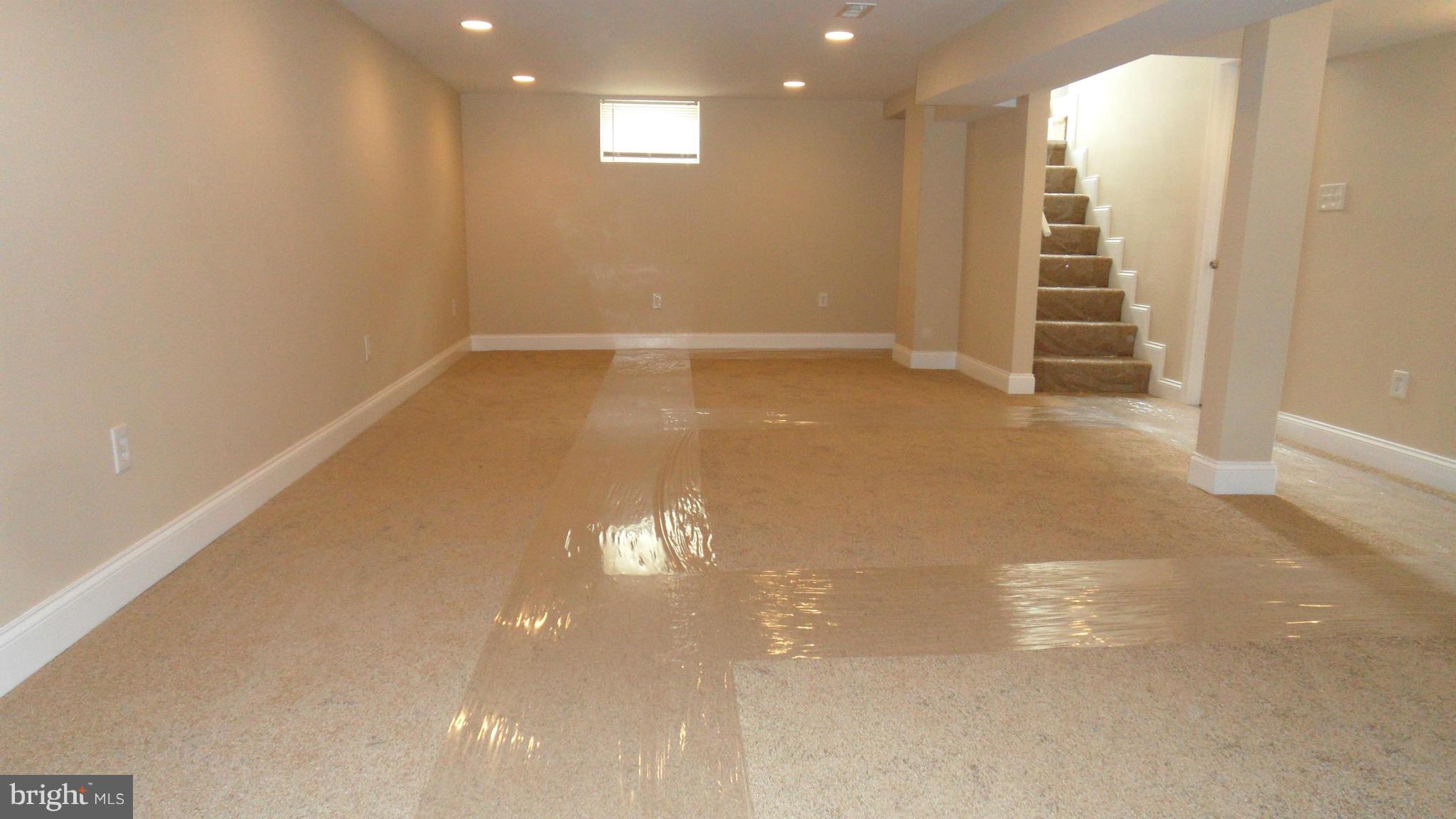 7413 Sudbrook Road Baltimore, MD 21208 - Photo 23 of 30 a view of a room with wooden floor and window