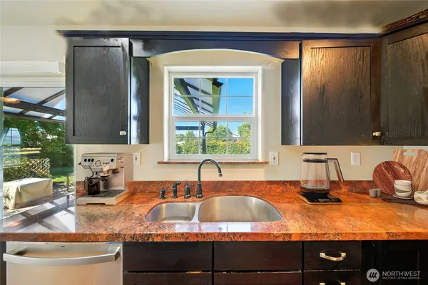 a kitchen with a sink and a window