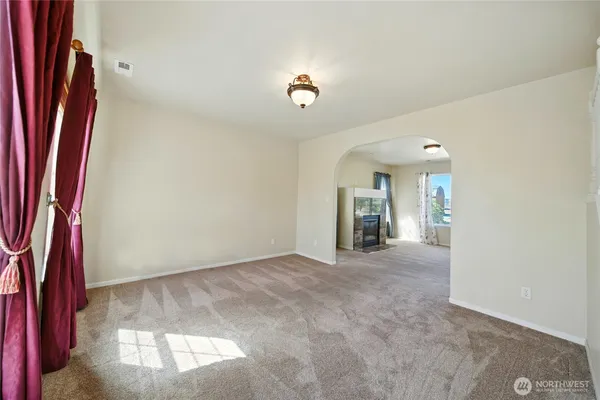 a bathroom with a granite countertop sink a mirror and a shower