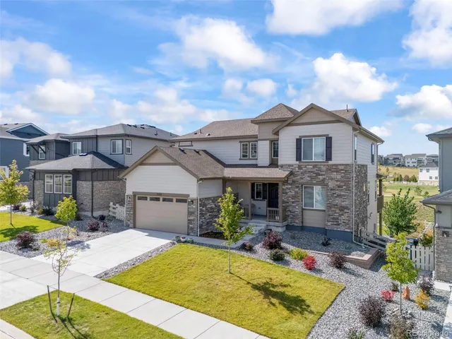 a view of house with yard outdoor seating and barbeque oven